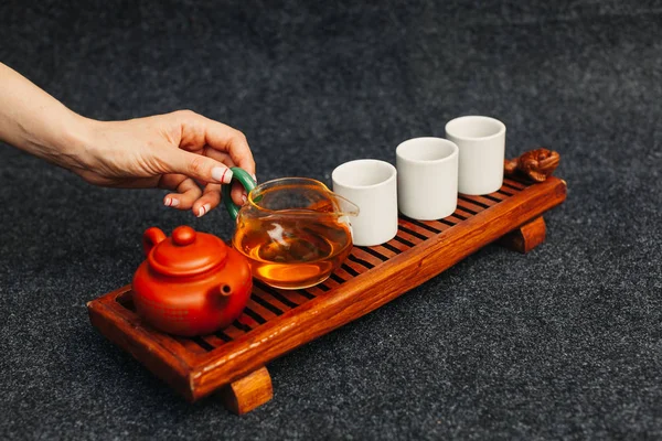 Traditional tea ceremony close up with woman hand — Stock Photo, Image