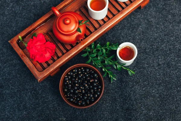 Traditional Chinese tea ceremony with black currant, fruit tea and healthy food. — Stock Photo, Image