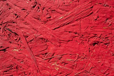 Eski, kırmızı boyalı bir OSB tablosunun yapısı