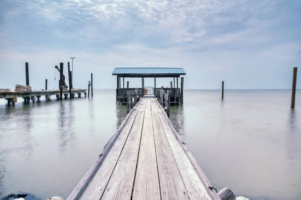 wooden jetty stretching out to sea