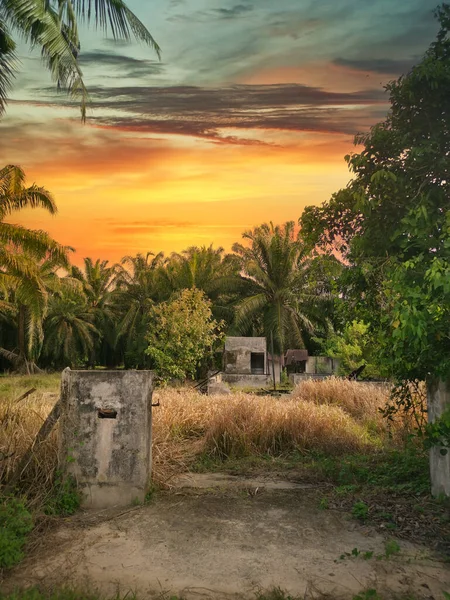 awesome sky scene at abandoned house around the dried grassy field