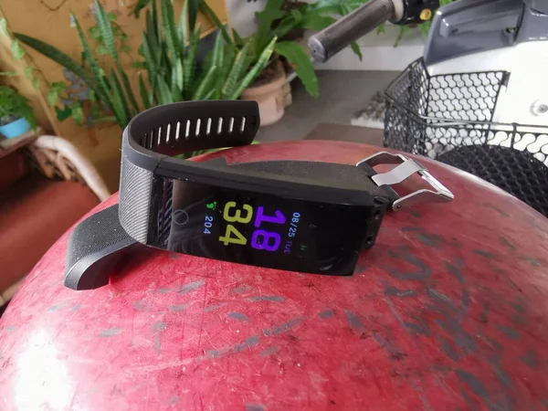 digital fitness waistband watch on display.