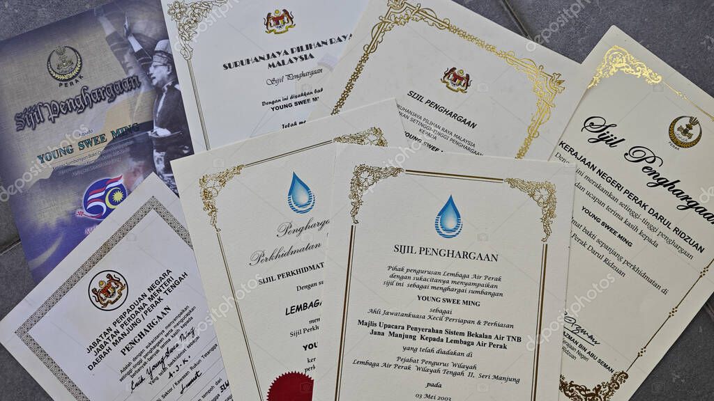 Perak,Malaysia. September 06,2025: Close in display or image of  someone's certificate of appreciation written in official language of Malaysia on display on the floor.
