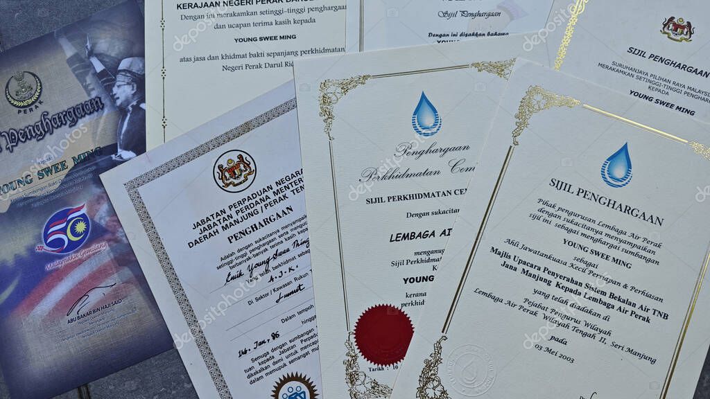Perak,Malaysia. September 06,2025: Close in display or image of  someone's certificate of appreciation written in official language of Malaysia on display on the floor.