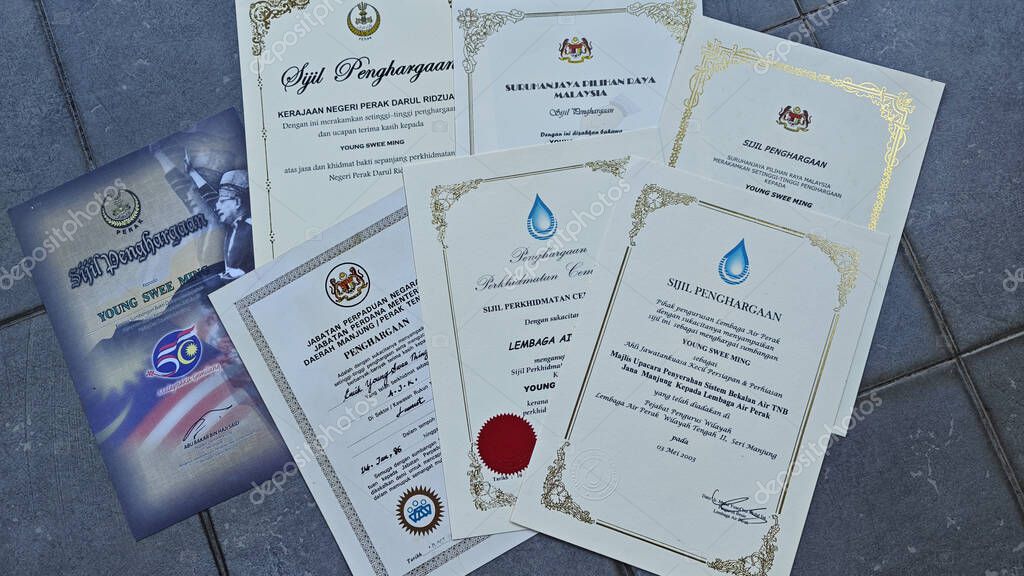 Perak,Malaysia. September 06,2025: Close in display or image of  someone's certificate of appreciation written in official language of Malaysia on display on the floor.