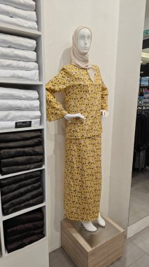 Perak, Malaysia. September 16,2025: Islamic Malay textile clothes for man,woman and children on sales and displays at some of the store at Aeon Mall,Sri Manjung.  