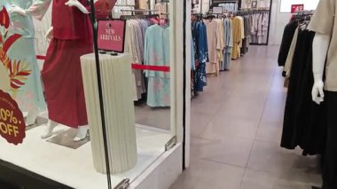 Perak, Malaysia. September 16,2025: Islamic Malay textile clothes for man,woman and children on sales and displays at some of the store at Aeon Mall,Sri Manjung.