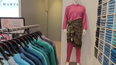 Perak, Malaysia. September 16,2025: Islamic Malay textile clothes for man,woman and children on sales and displays at some of the store at Aeon Mall,Sri Manjung.