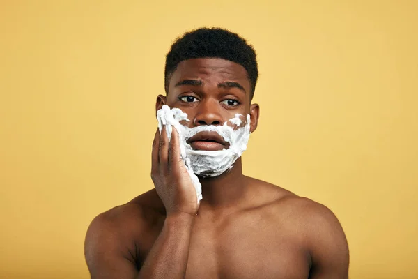 Young handsome man having problems with skin during shaving his beard — 스톡 사진