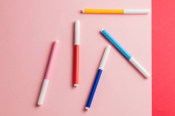 different soft-tip pens lying on the table