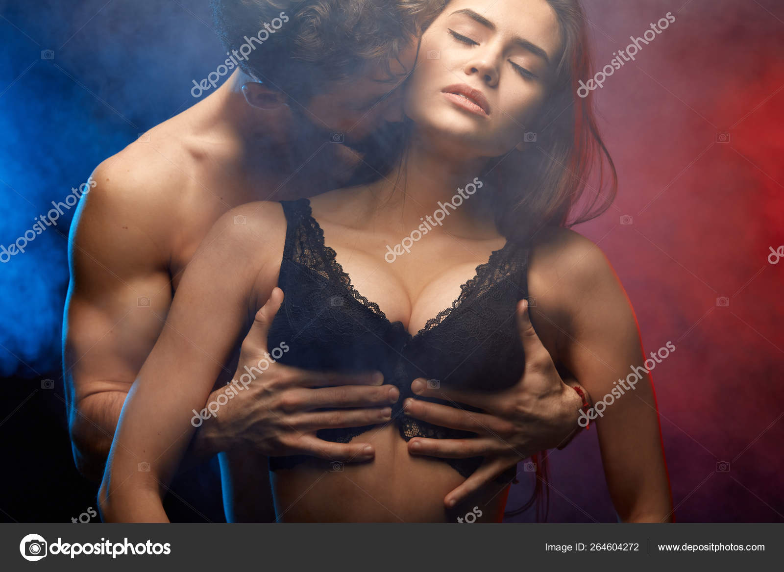 Passionate man hugging his girlfriend breast and kissing her Stock Photo by  ©1greyday 264604272