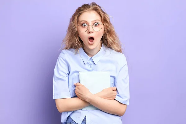 funny girl with bugged eyes being surprised with results of exams