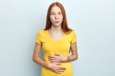 Young woman suffers from cramp