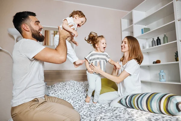 Young parents enjoying weekend with children — Stock Photo, Image