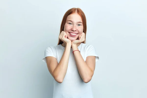 Positive female student holds chin — Stock fotografie