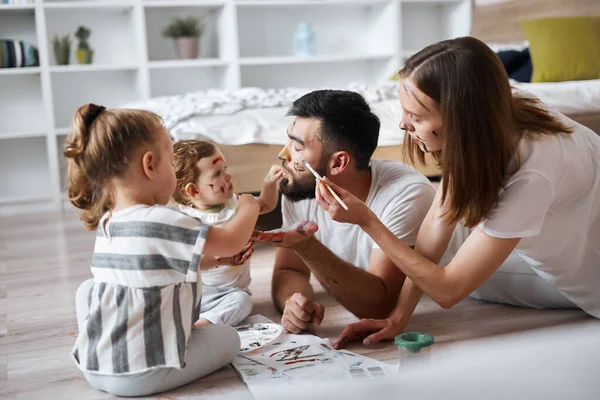 Kind awesome couple playing with their children — Stock Photo, Image