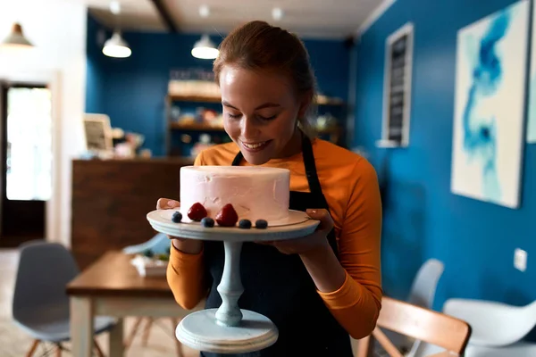 cherming beautiful confectioner smelling wonderful cake