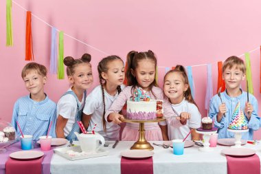 little beautiful girl giving cake to her guests clipart