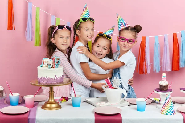 Little awesome girls congratulating their best friend with birthday — Stock Photo, Image