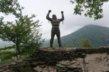 Statue of Unbound Prometheus with Broken Chain on the Eagle Rocks in the Caucasus, raw original picture clipart