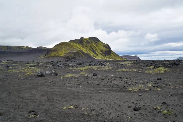 Vulcanic landscape in the highlands of iceland, black ash deserts with green moss 2020