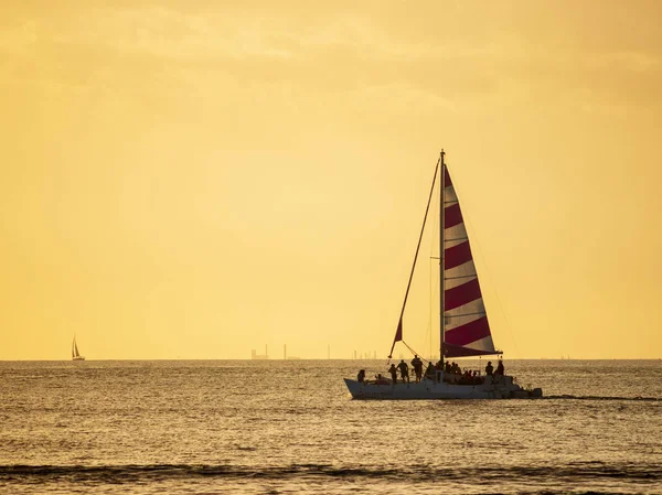 Sailboat at Sunset in Ocean