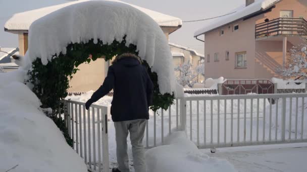 Man Open Door Snowy Yard Leave Home — Stock Video