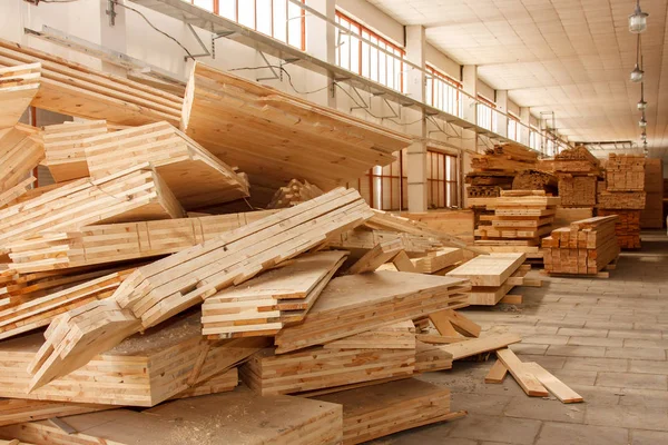 Wooden sandwich panels piled up in the workshop.