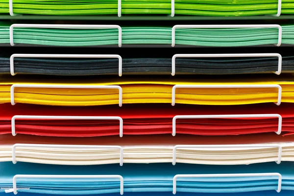stacks of colored drawing paper in the store