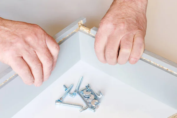 The connection of the two walls of the kitchen drawer when assembling furniture — Stock Photo, Image
