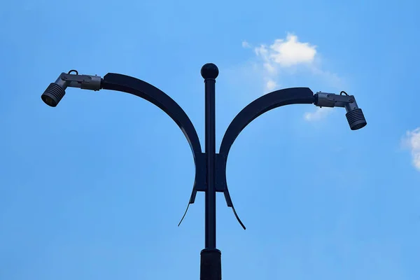 A modern street lamp against the blue summer sky. — Stock Photo, Image