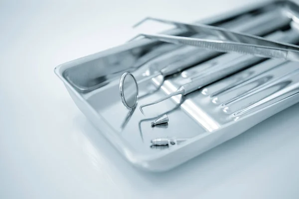 Set of metal dental tools for dental care and prosthetics.Selective focus.