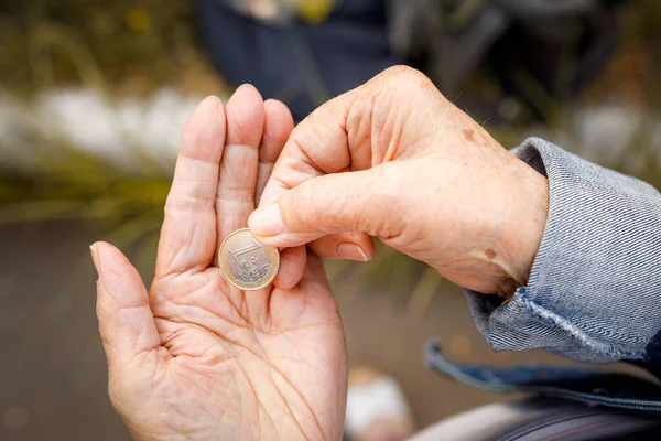 One Euro Coin Hands Elderly Lady Poverty Concept Retirement Savings — Stock Photo, Image