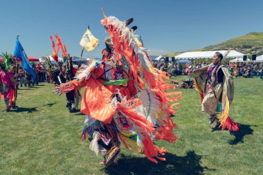 Dancers. A Pow Wow is an American Indian social gathering or fair which usually includes competitive dancing or discussions. 2019 21st Annual Chumash Day Powwow and Intertribal Gathering, Malibu, California, April 13, 2019 clipart