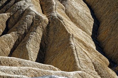 Taş yüzey. altın kanyon. Zabriskie Point Loop Ölüm Vadisi Milli Parkı. Yakın çekim, doku, Jeoloji