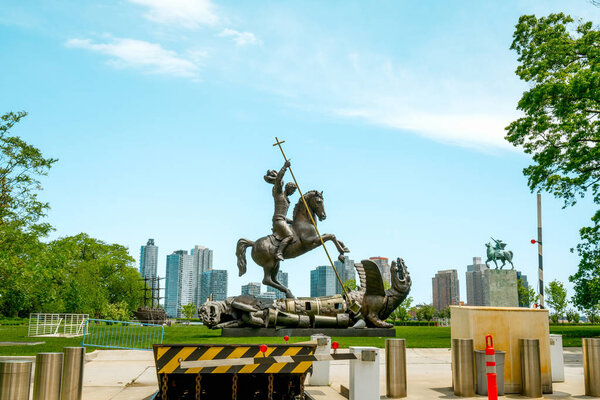 New York City/USA - May 25, 2019 UN Gift Garden, Good Defeats Evil Statue Outside the United Nations Building, 1St Avenue, NYC