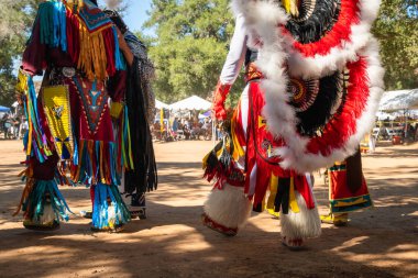 Powwow.  Native Americans dressed in full regalia. Details of regalia close up.  Chumash Day Powwow and Intertribal Gathering. clipart