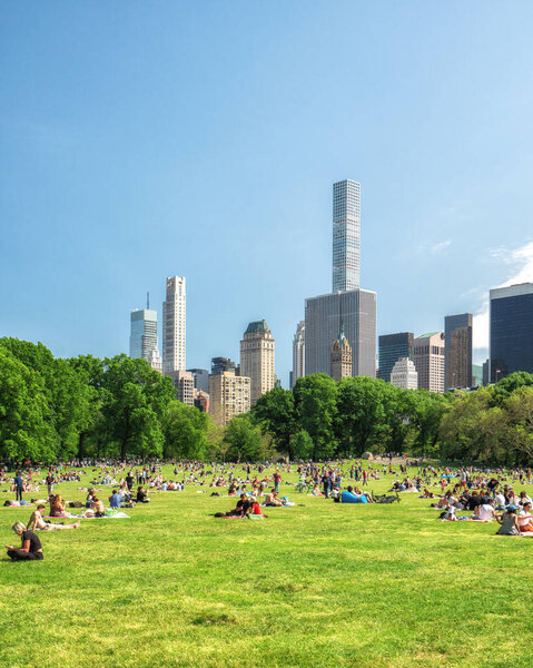 New York City/USA - May 25, 2019 People Resting in Central Park, Beautiful Sunny Day in New York City.