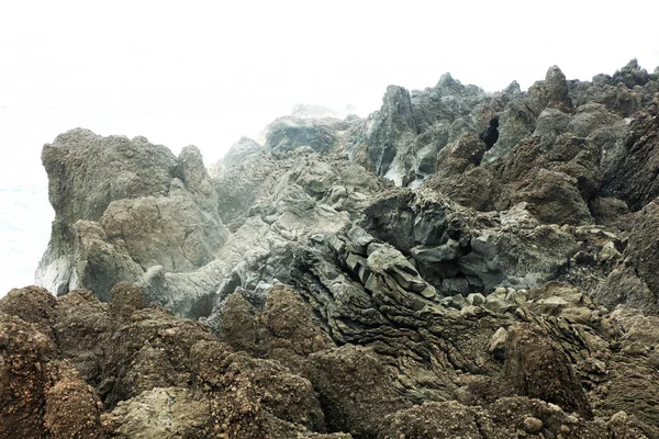 Volcanic Rocks Ocean Shore Stock Photo