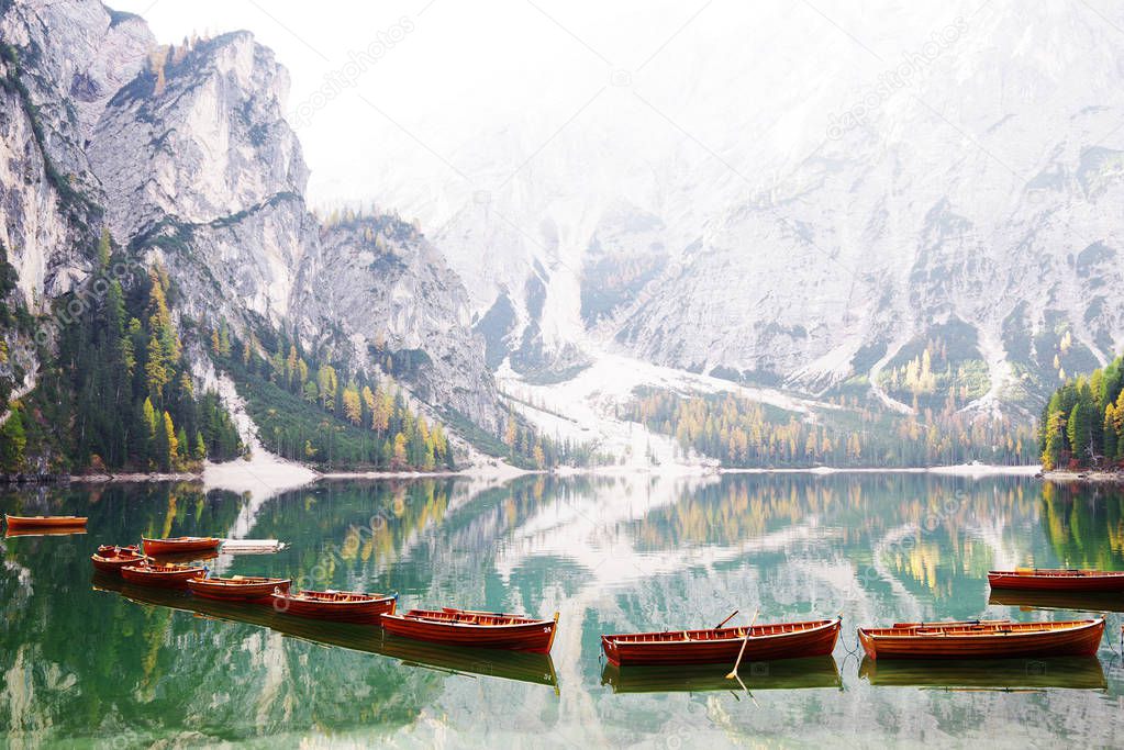 View of Braies lake in a colorful autumn landscape in Italian Dolomites alps, Pusteria Valley, inside the Fanes - Sennes and Braies nature park