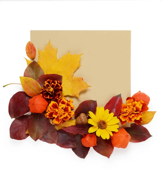 Autumn border. Creative Composition of vibrant red and yellow leaves and card for text on a white background. Flat lay Top view trendy background.