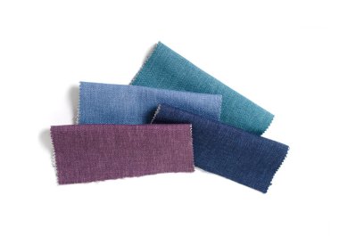 Topçu Tekstil örnekleri parlak topluluğu. Kumaş doku arka plan.