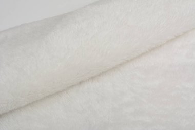 Soyut yapay doku kürk dokusu, arka plan, yakın plan. Yumuşak malzeme arka plan, çocuk oyuncakları sahte kürk.