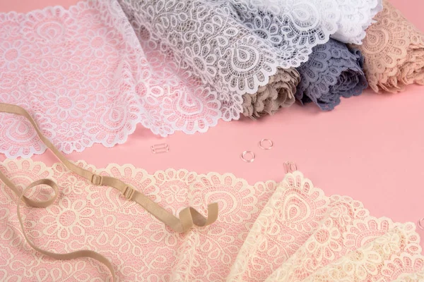 Roll Delicate Color Laces Panties Bras Pink Background Plastic Fittings — Φωτογραφία Αρχείου