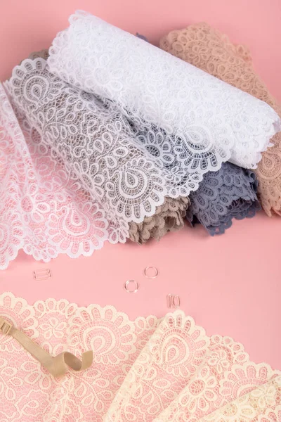 Roll Delicate Color Laces Panties Bras Pink Background Plastic Fittings — Φωτογραφία Αρχείου