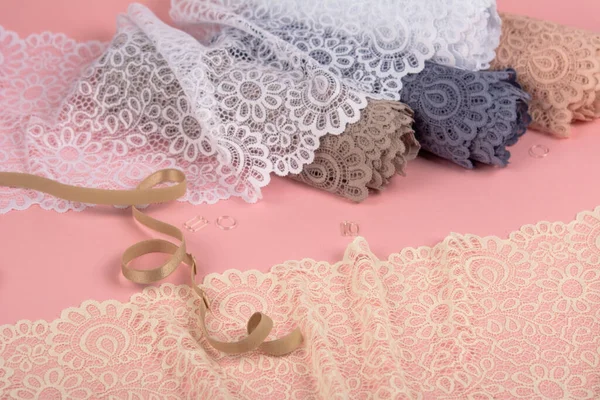 Roll Delicate Color Laces Panties Bras Pink Background Plastic Fittings — Φωτογραφία Αρχείου