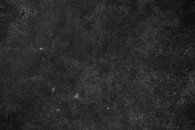 Concrete black dark gray background with scuffs and black splashes. Textured wall texture in the grunge style. clipart