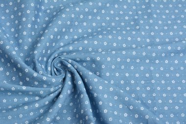 Mavi kumaş dokusu, yakın plan, arka plan. Dikiş ve terzilik için, elbise ve kumaş dikmek için