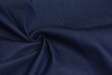 Mavi kumaş dokusu, yakın plan, arka plan. Dikiş ve terzilik için, elbise ve kumaş dikmek için