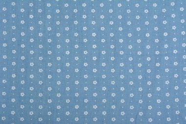 Mavi kumaş dokusu, yakın plan, arka plan. Dikiş ve terzilik için, elbise ve kumaş dikmek için